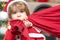 Santa boy celebrate christmas at home. Delivery christmas gifts. Funny little Santa Claus with huge red bag with