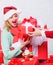 Santa bring her gift that she always wanted. Woman excited blonde hold gift box with bow. Perfect gift for girlfriend or