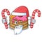 Santa with candy pancake with strawberry mascot cartoon