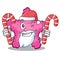 Santa with candy pink starfish animal on mascot sand