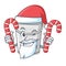 Santa with candy plastic tube bucket in the mascot