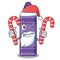 Santa with candy purple crayon in a mascot bag