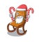 Santa with candy toy rocking chair above cartoon table
