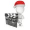 Santa with cinema clapperboard.