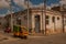 SANTA CLARA, CUBA: Motorcycle taxi rides on the road, typical street in Downtown of the capital city of the Cuban province.