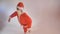 Santa Claus artist makes silly ballerina moves.