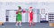 Santa claus boxer practicing boxing exercises with elf helper workout healthy lifestyle christmas holidays celebration