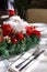 Santa Claus doll face with curly beard, toy santa on a dining table