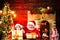 Santa Claus - father and son with a bag full of presents. Lovely baby enjoy christmas. Santa helper. Dreamy toddler on