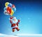 Santa Claus flies on a balloon