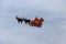 Santa Claus flying in his sleigh pulled by his reindeer during the Christmas market in Montreux, Switzerland