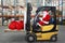 Santa Claus forklift operator in warehouse