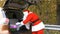 Santa Claus gets gifts from the trunk of the car 50 fps