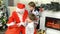 Santa Claus Giving Presents to Children