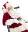 Santa Claus With Hands On Stomach Sitting On Chair
