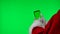 Santa Claus hands in white gloves using smartphone, swipe and tapping at the green screen chroma key. Isolated on a