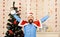 Santa Claus with happy face with Christmas tree on background