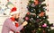 Santa Claus with happy face near wooden wall and tree