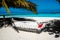 Santa Claus hat at caribbean sandy beach, Maldives. Santa Clause hat on hammock on the beach.