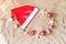 Santa Claus hat, christmas balls, gifts, seashells and starfishes