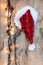 Santa Claus hat hung on a wooden wall