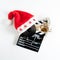 Santa Claus hat on a movie clapper board