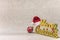 Santa Claus hat put on a golden word Merry Christmas with a Christmas Tree snowflakes pattern ornament ball on a glitter silver s