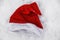 santa claus hat in the snow abandoned or forgotten