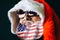 Santa Claus in hat and sunglasses is laughing. American flag on the beard. LGBT friendly. Celebration concept. 2020 new year