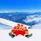 Santa Claus heap with Christmas gifts against snow winter mountain