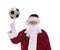 Santa Claus with his index finger pointing up with a soccer ball balanced on the tip, isolated on white