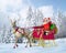 Santa Claus on his sleigh and reindeer, snow capped trees being at the background.