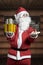 Santa Claus hold big gifts on the right hand and small gifts on