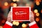 Santa Claus hold tablet in horizontal position with Merry Christmas and Hanppy New Year greeting