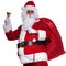 Santa claus holding bag on shoulder is ringing bell
