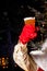 Santa Claus holding a beer plastic glass.