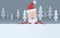 Santa Claus holding a big white placards in a grey forest.3d illustration