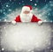 Santa Claus holding blank advertisement banner