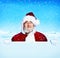 Santa Claus Holding a Blank Sign Snowing Concept