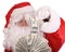 Santa Claus holding dollar banknote.