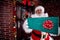 Santa Claus holding gift box, Santa Claus gloved hands holding g