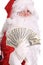 Santa Claus holding money.