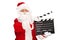 Santa Claus holding a movie clapperboard