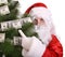 Santa Claus holding pine with money.