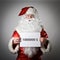 Santa Claus is holding a white paper in his hands. One million d