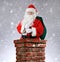 Santa Claus Inside Chimney Snowy Background