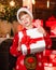 Santa claus kid. Christmas shopping. Christmas mood concept. Fancy style. Happy winter holidays. Christmas coming