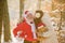 Santa Claus kisses a woman. Christmas and New year. Santa Claus with girl kissing outdoor in snow.