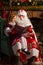 Santa Claus and little girl reading book