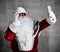 Santa Claus make selfie with mobile cellphone show thumbs up. New year and Merry Christmas